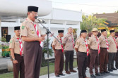Bupati HM Wardan Pimpin Apel Gelar Senja Kwarcab 04.02 Gerakan Pramuka Kabupaten Inhil